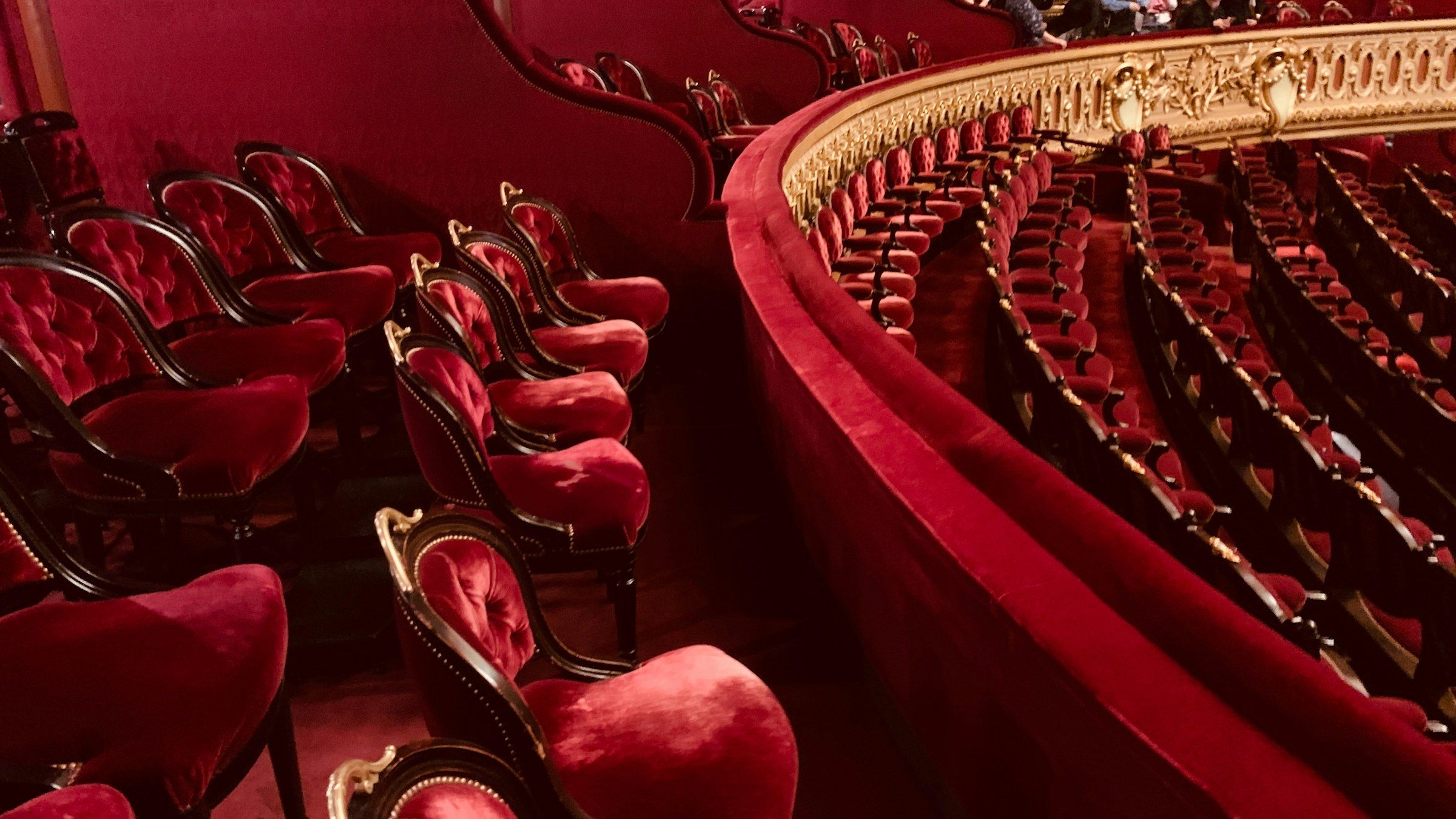 The Royal Opera House at Covent Garden (Luxurious red velvet seats in an ornate theater)