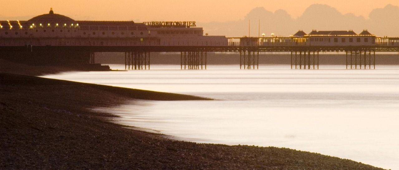 Brighton West Pier and seafront at sunset