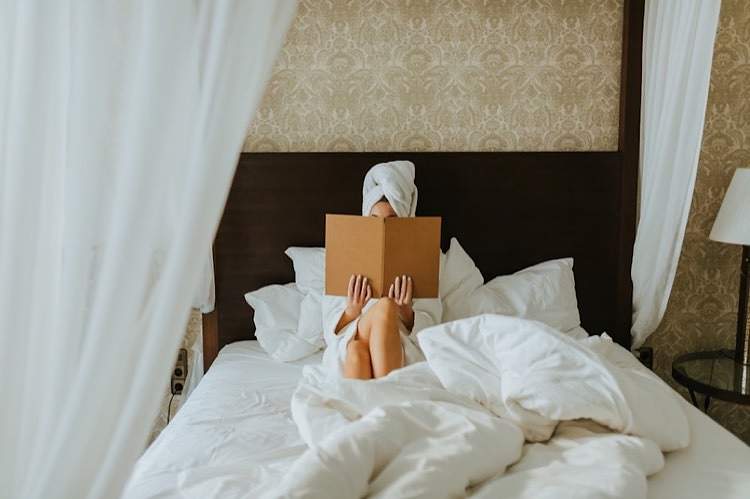 Person enjoying a hotel suite