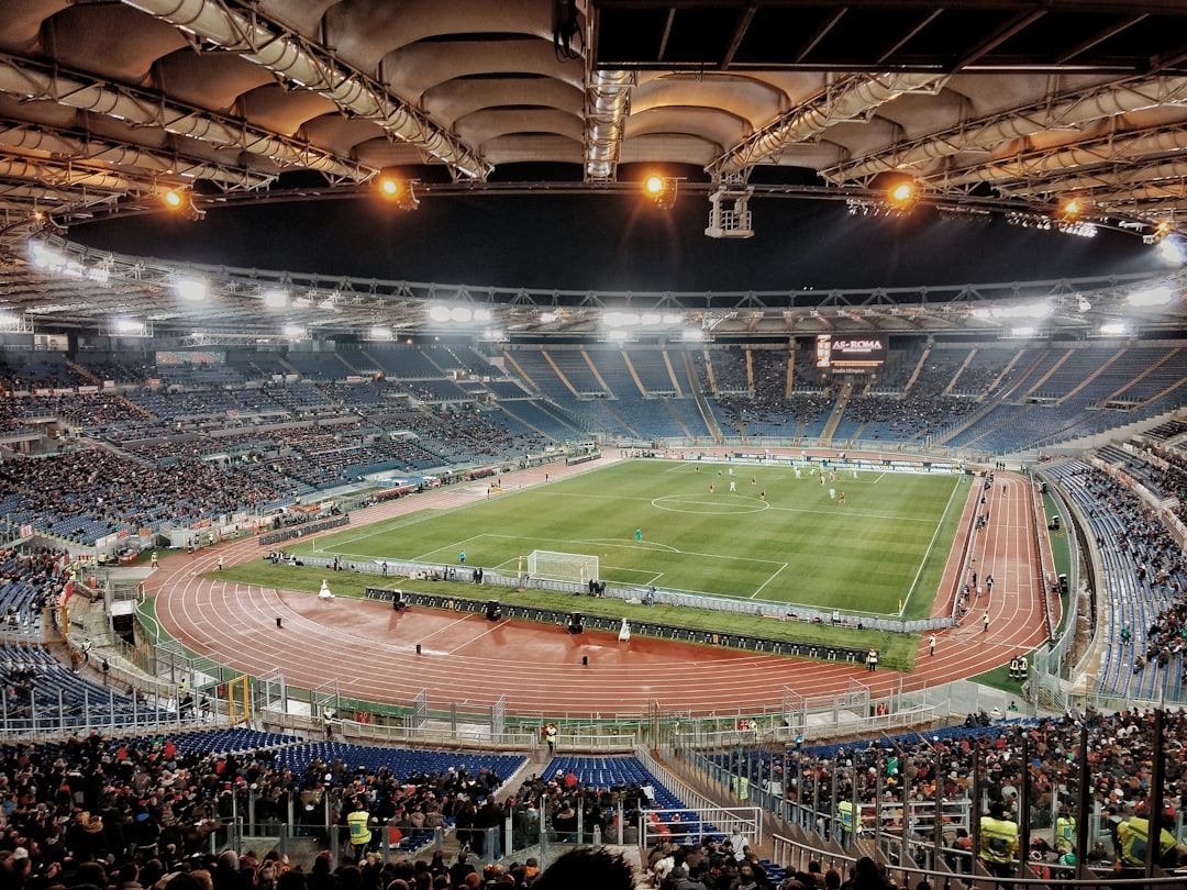 Football stadium illuminated at night during a European Championship match