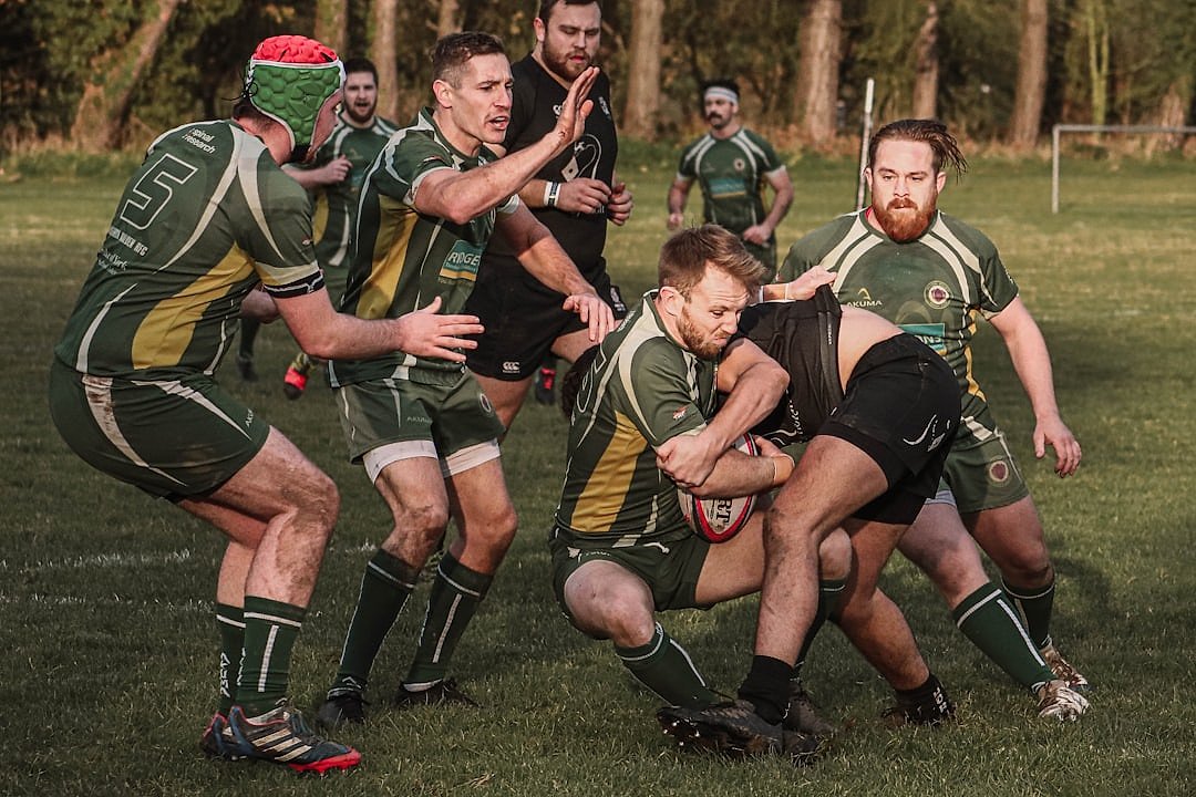 Rugby player running with the ball during a match