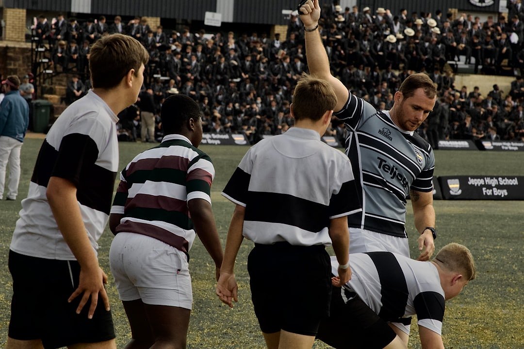 Rugby players in a team huddle before a match