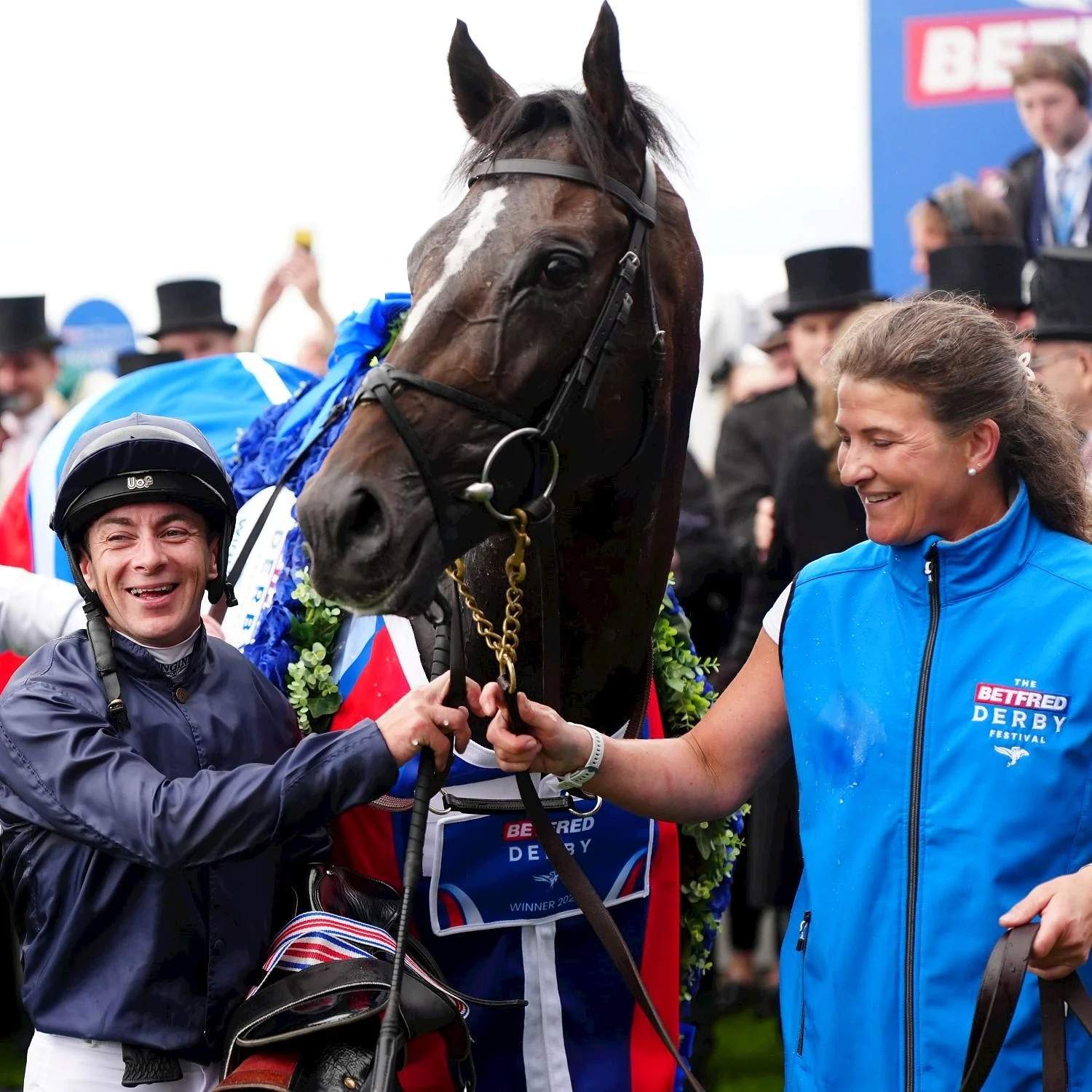 Winning jockey and horse in the Epsom Derby winner's enclosure
