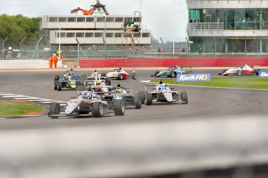 Formula 1 cars racing on track during a Grand Prix