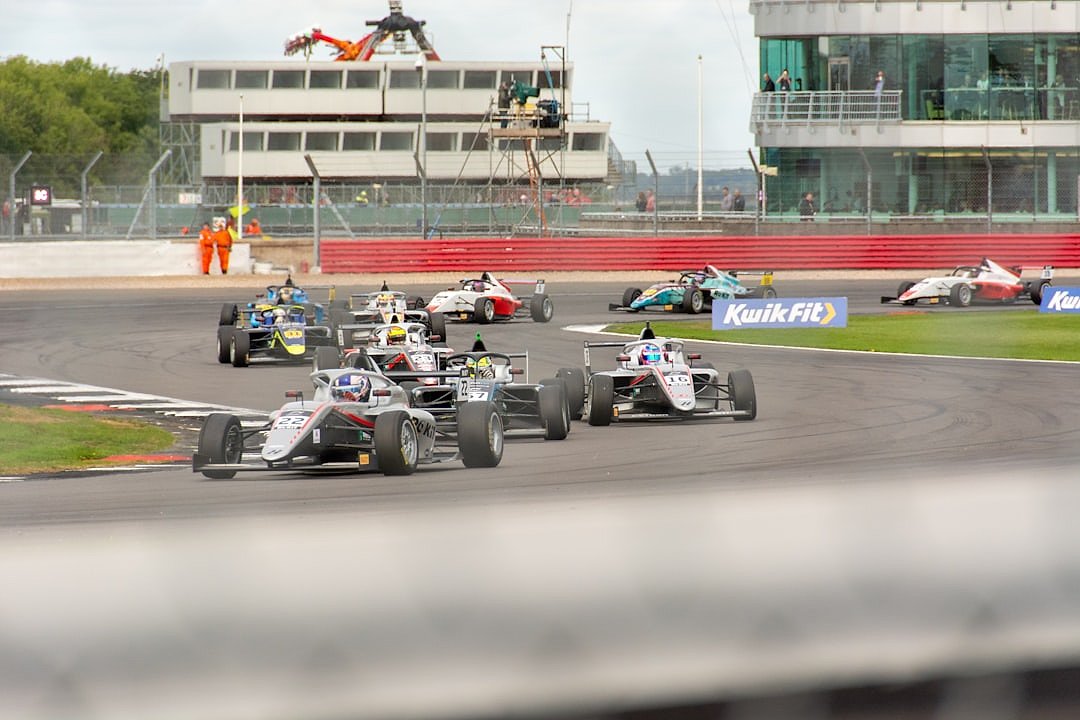 Formula 1 cars racing on track during a Grand Prix
