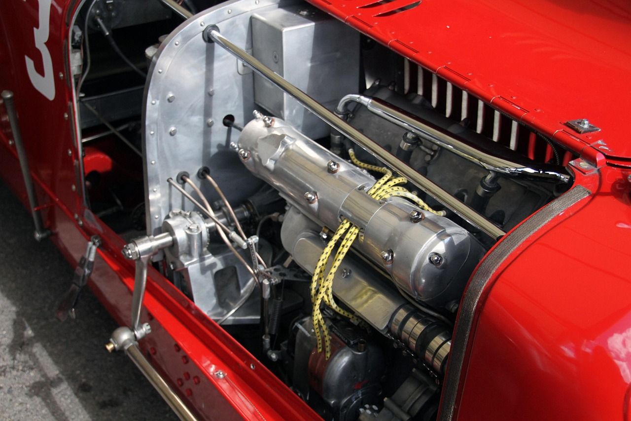 Close-up of a vintage racing car engine typical of the Goodwood era