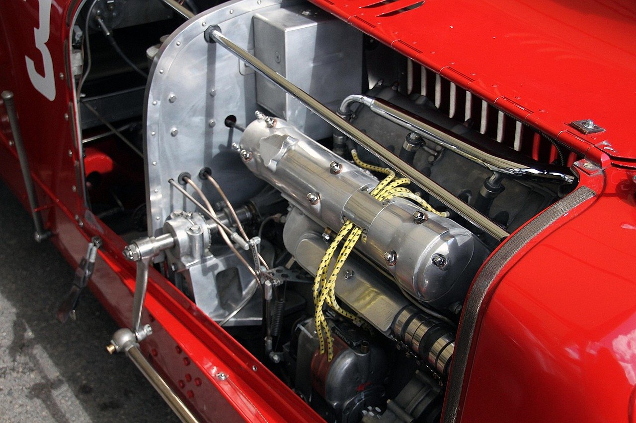 Close-up of a vintage racing car engine typical of the Goodwood era