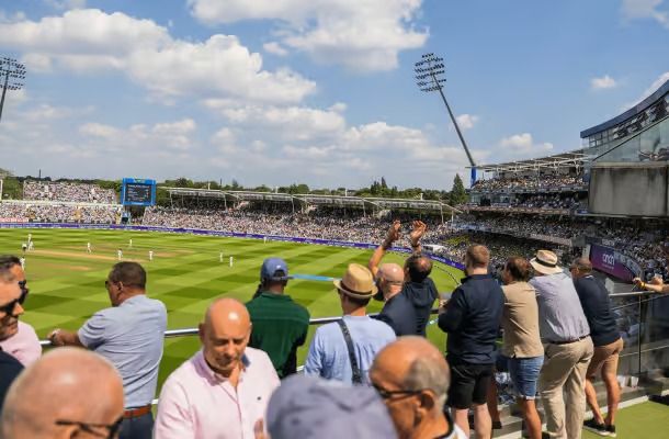 A cricket match seen from the pavilion