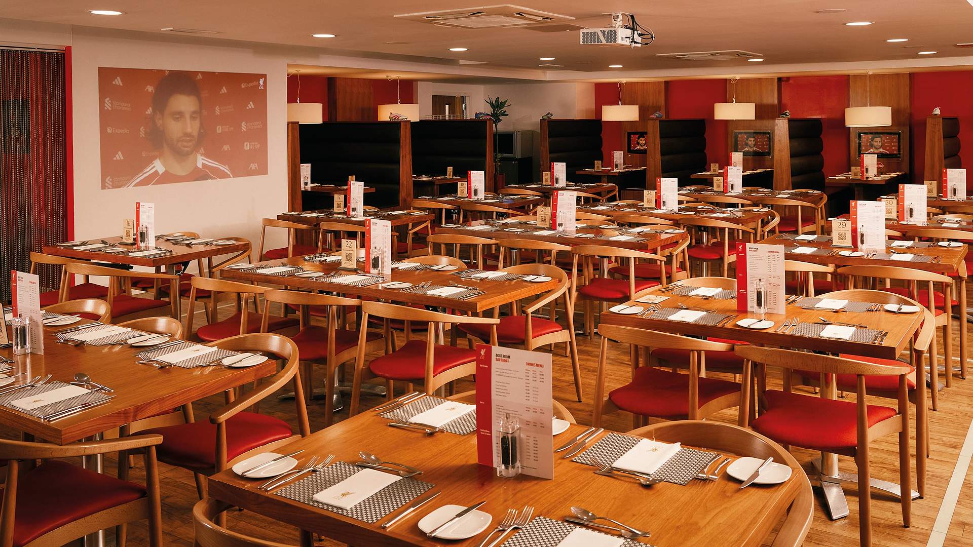 The Boot Room Restaurant, Anfield: The Boot Room Restaurant dining room with set tables and booths