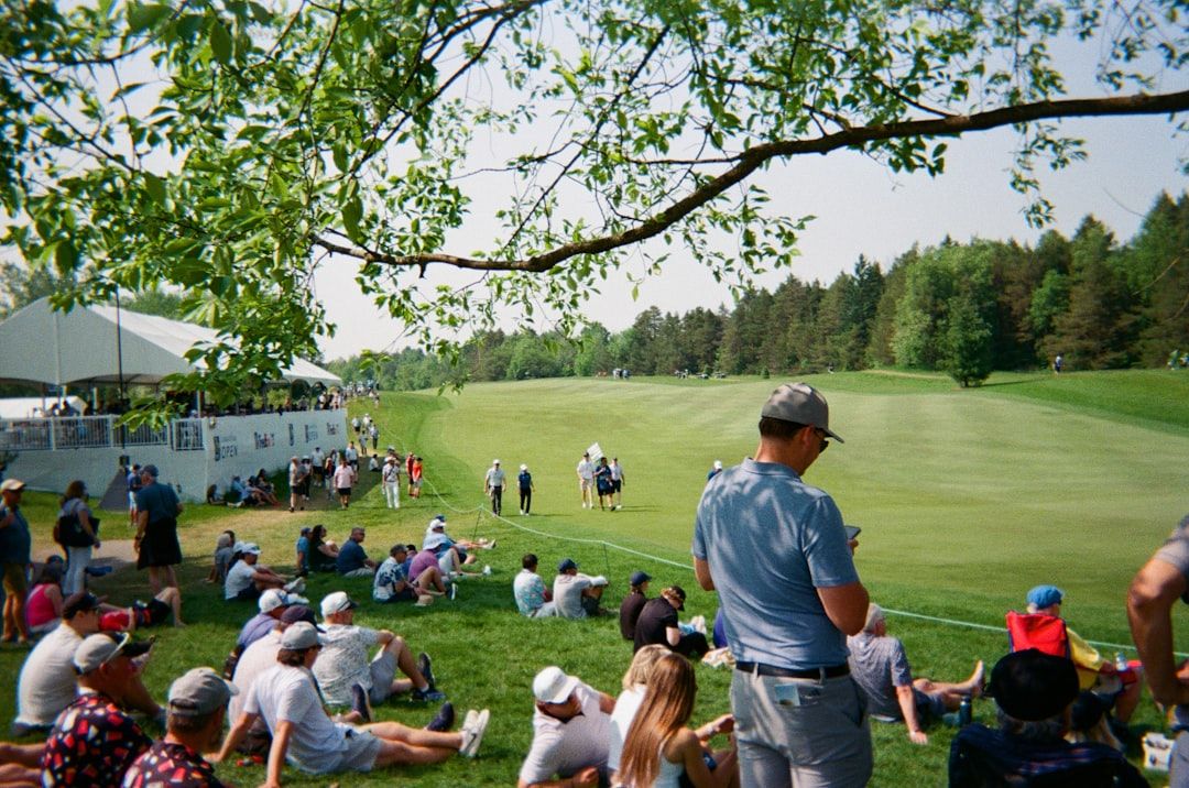 Golf tournament spectators in grandstands watching The Open Championship
