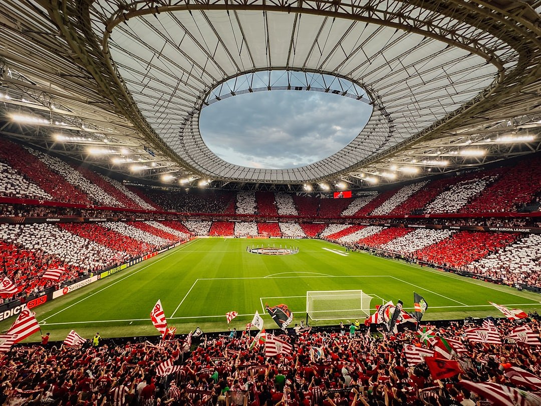 Football stadium crowd celebrating a cup final victory