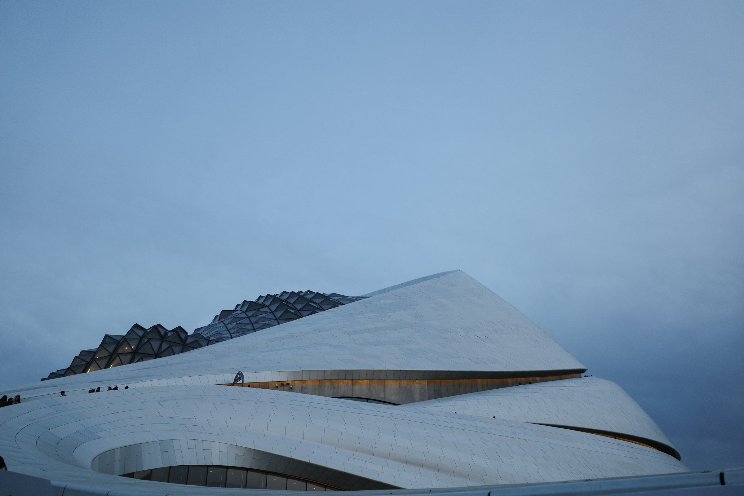 The Royal Opera House at Covent Garden (Modern white building with curved lines under a grey sky)