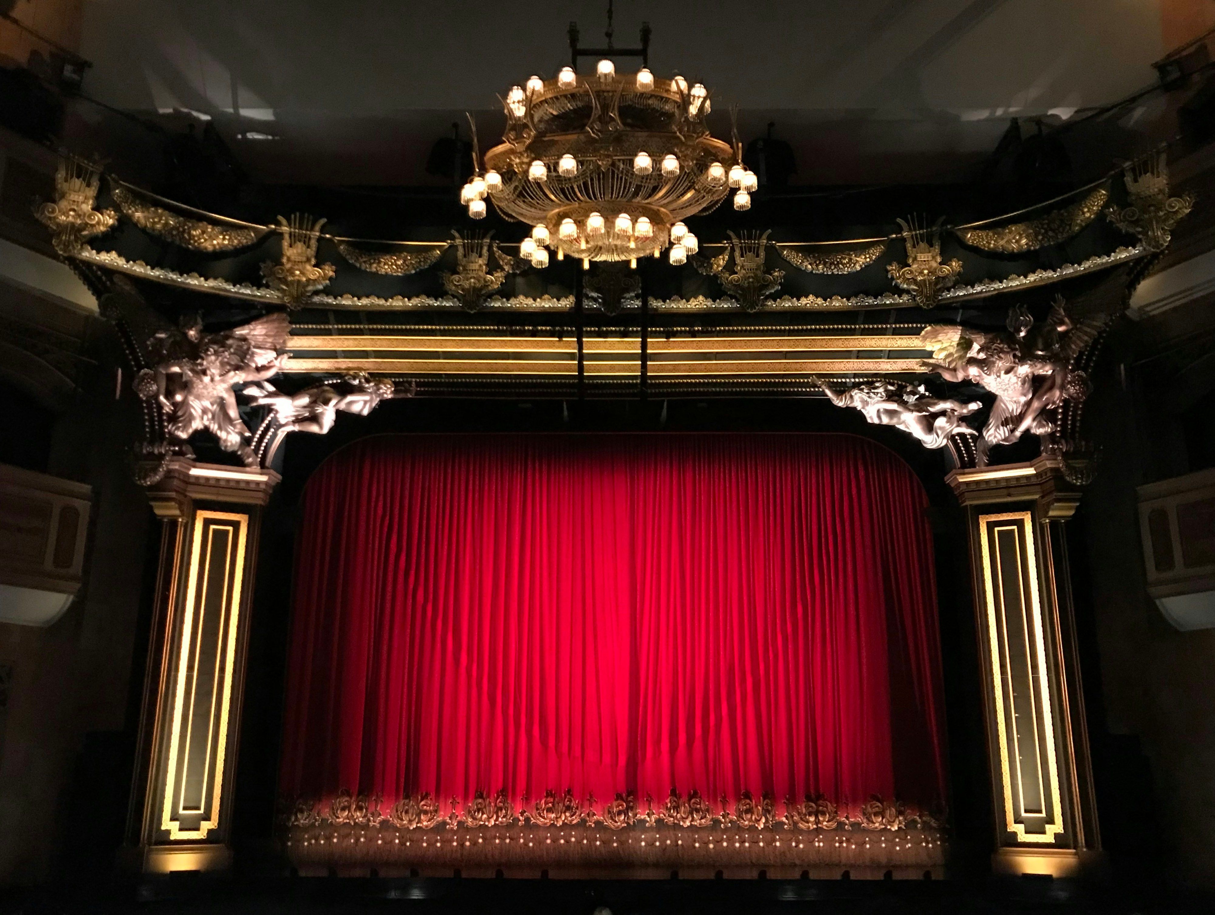 Red curtain on a musical theatre stage