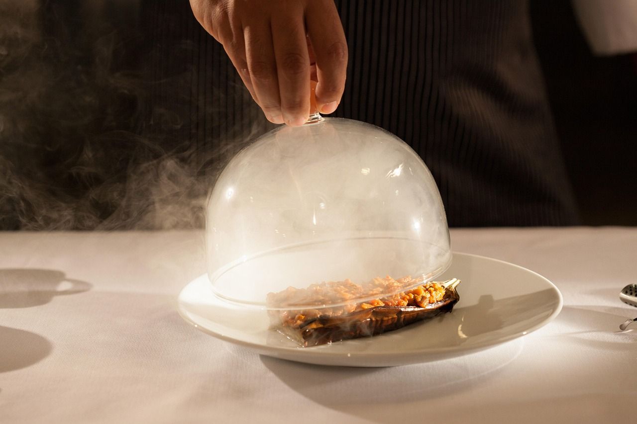 Fine dining service with theatrical smoke presentation