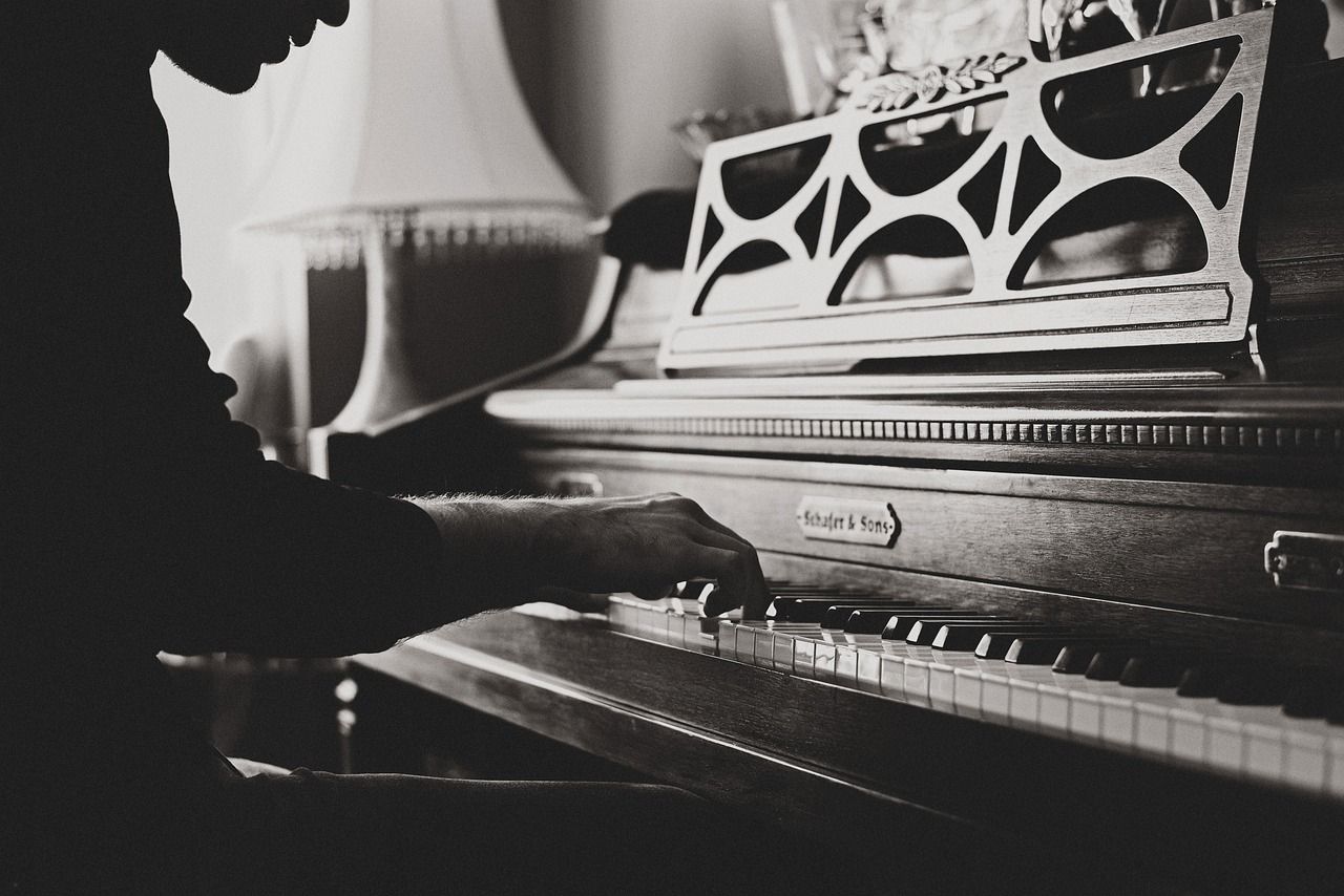 Pianist performing, representing Elton John's role as composer of The Devil Wears Prada musical