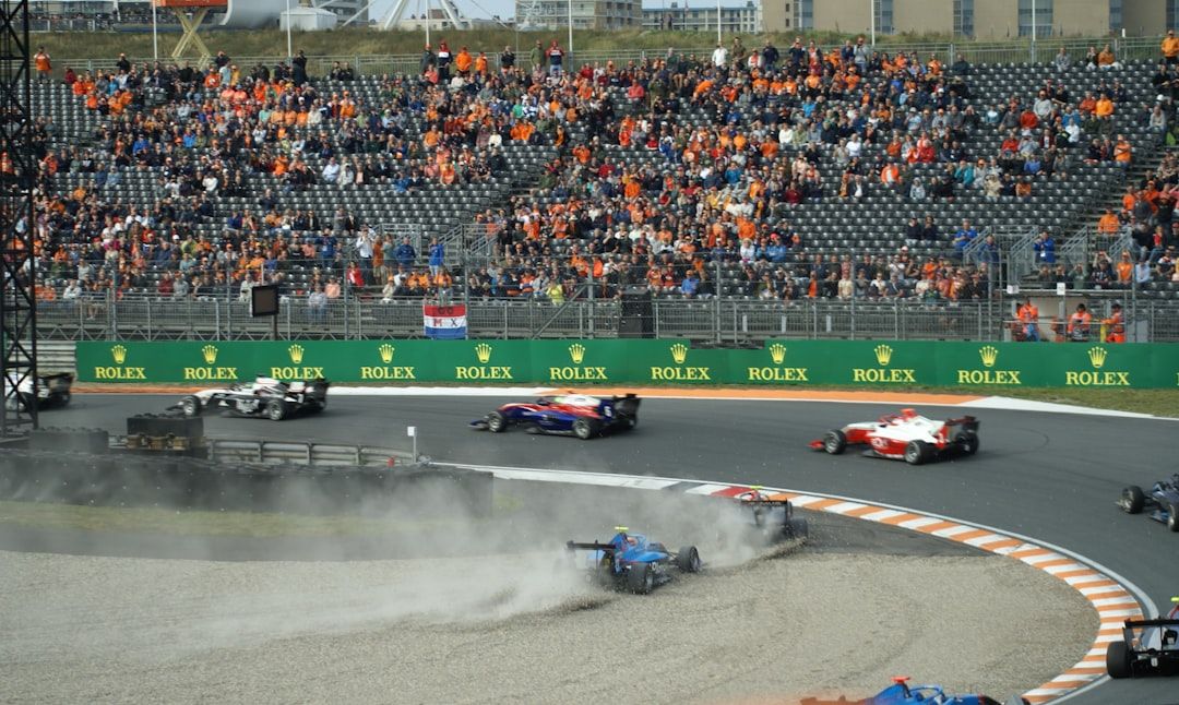The start of a Formula 1 race at Zandvoort with packed grandstands and cars heading into the first corner