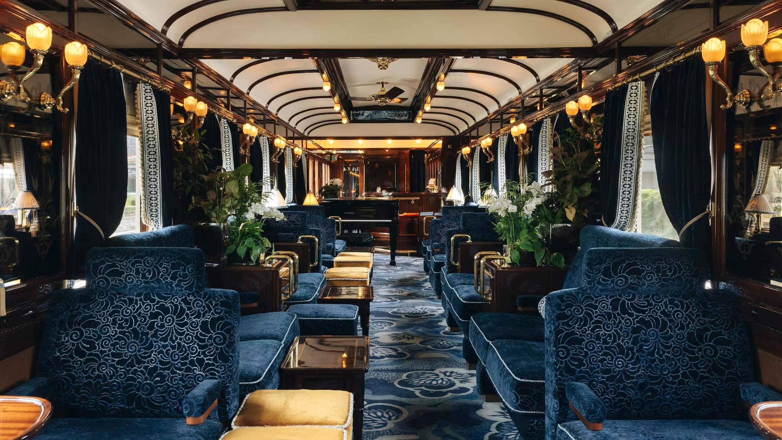 The blue-and-gold lounge car of the Venice Simplon-Orient-Express, restored 1920s carriage interior