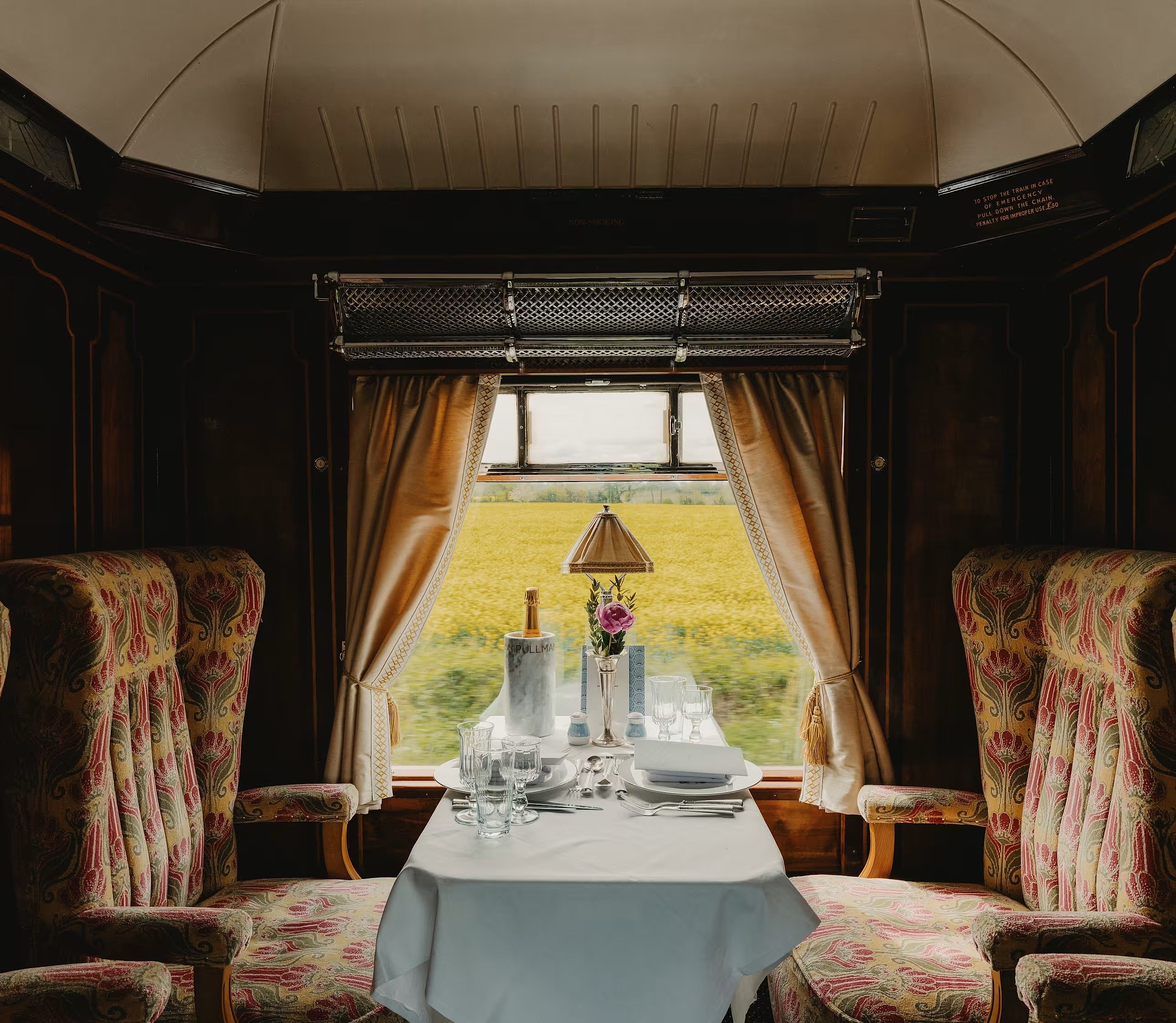 Belmond British Pullman interior showing elegant table settings and marquetry panels