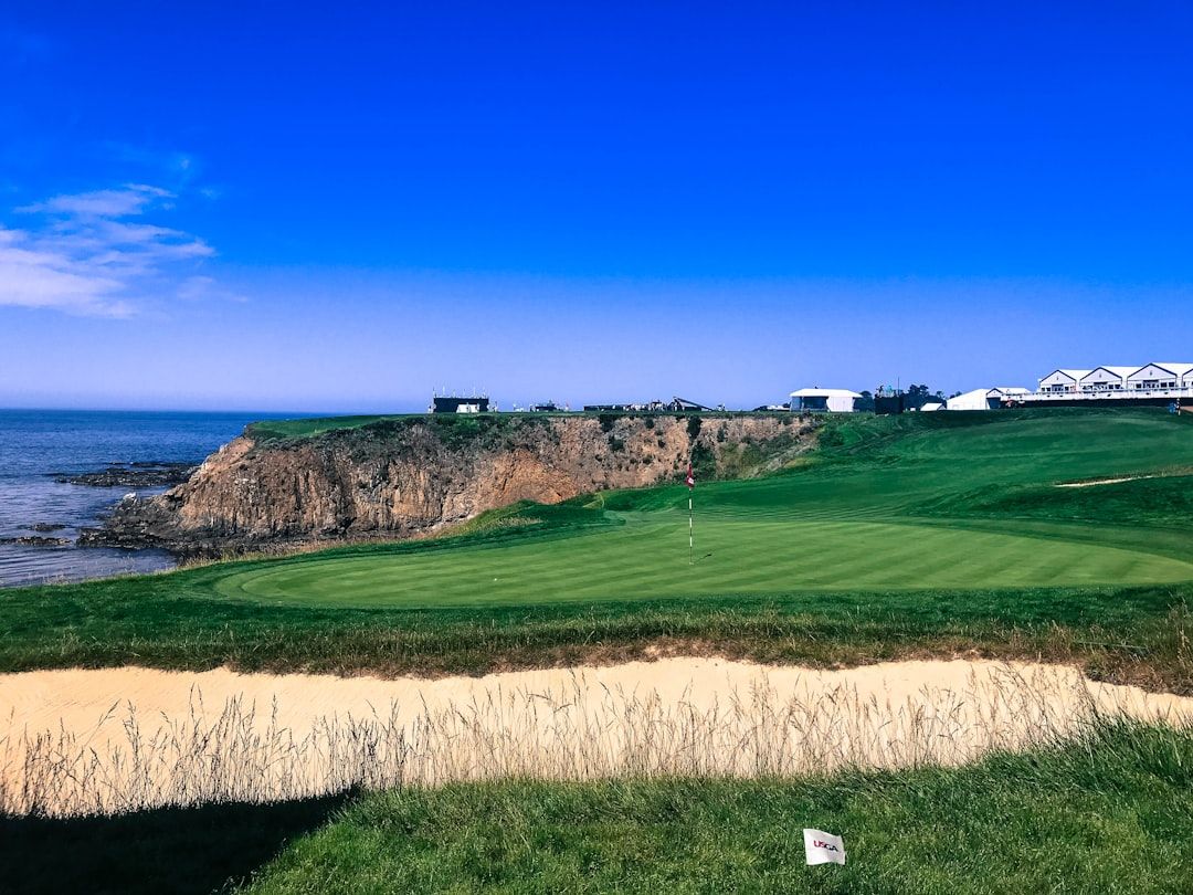 Dramatic clifftop links golf course overlooking the ocean, evoking Royal Portrush