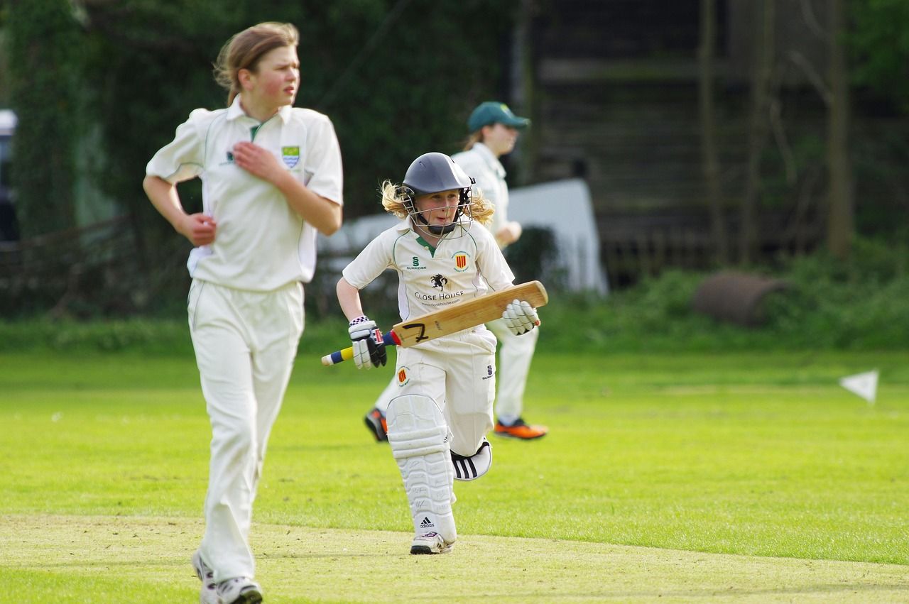 Cricket batter playing a defensive shot