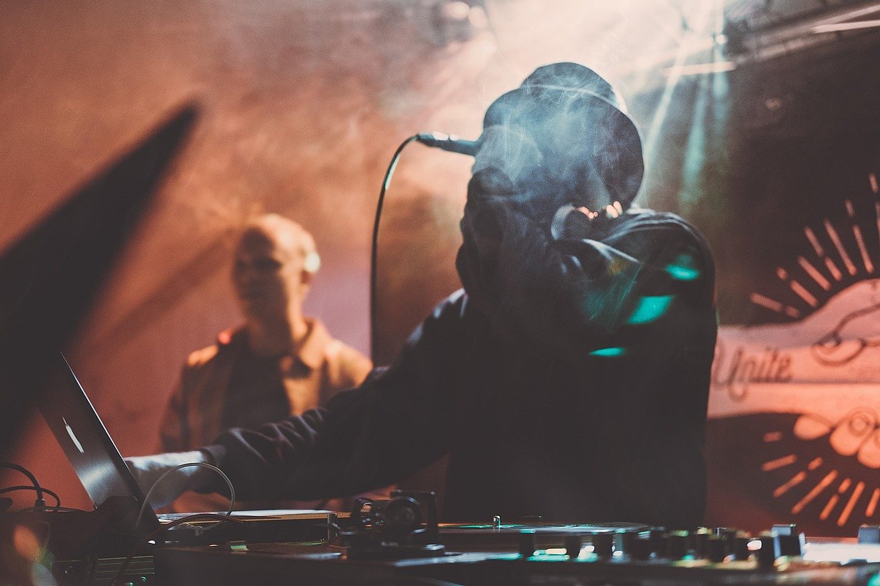 Singer performing on stage with dramatic lighting