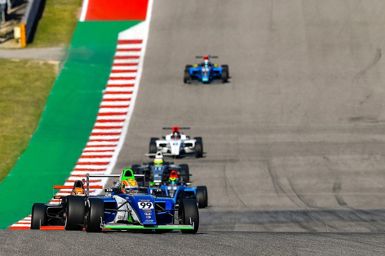 Open-wheel racing car on the Circuit of the Americas track