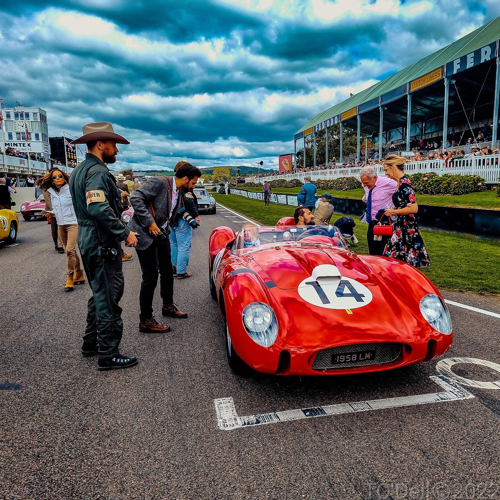 Vintage Ferrari and Goodwood Revival visitors in period dress