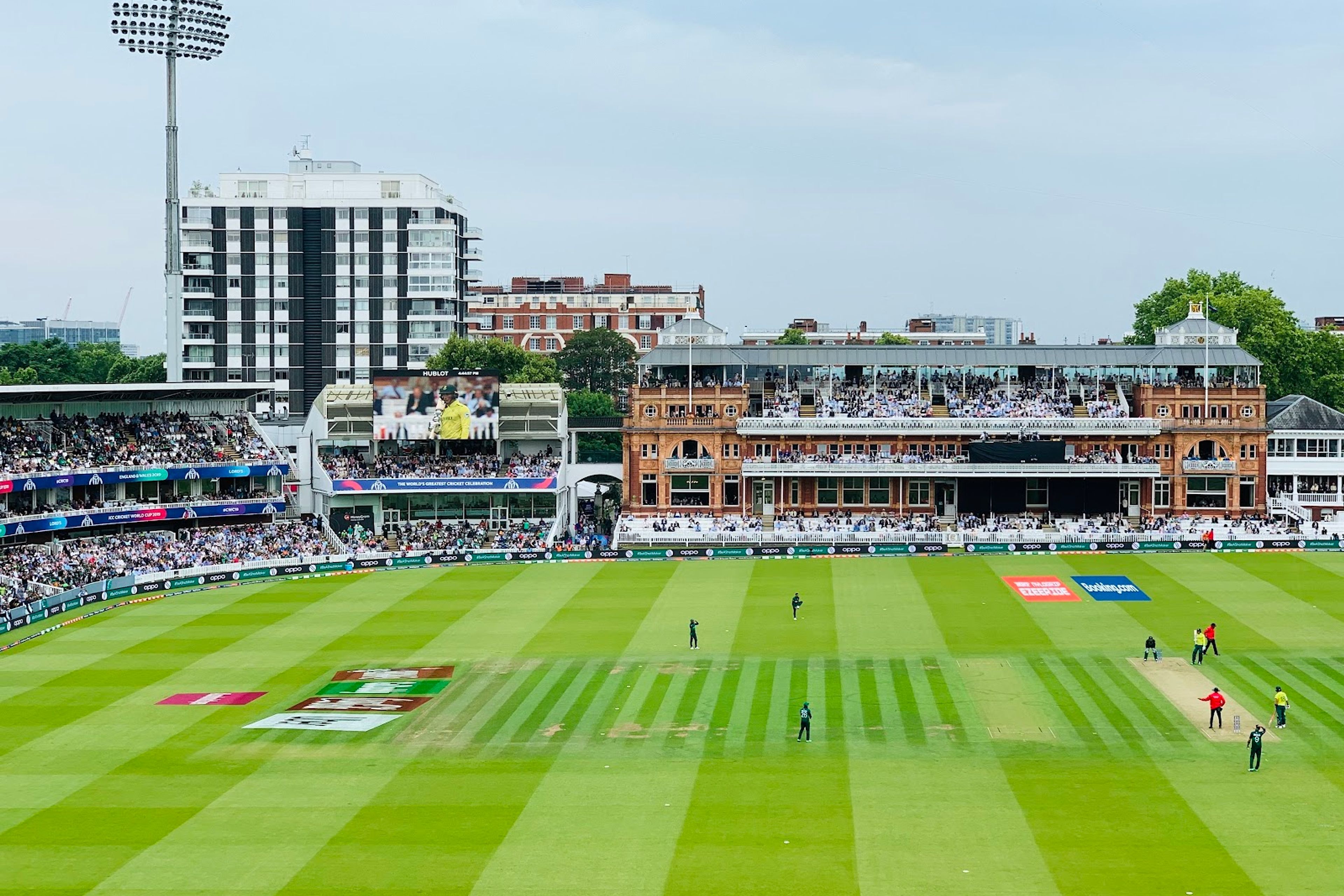 Lord's Cricket Ground on a full day's play, the Victorian Pavilion across the ground