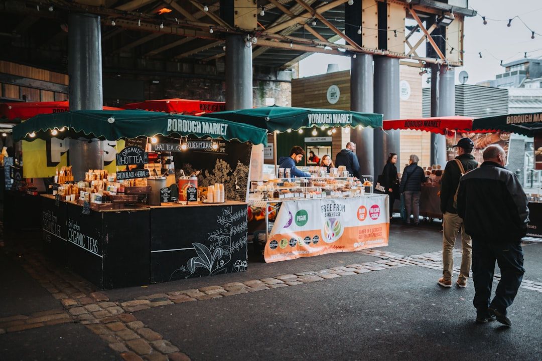 Visitors browsing gourmet food stalls at an outdoor festival