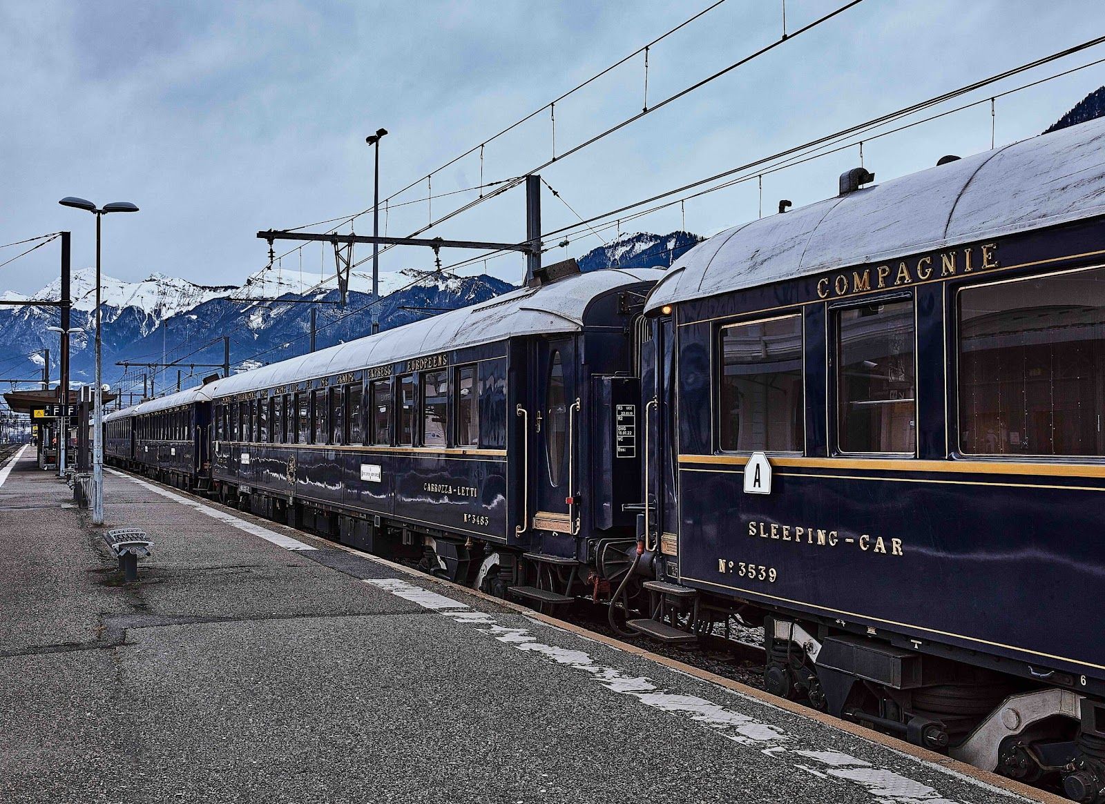 The Venice Simplon-Orient-Express train passing through the Alps