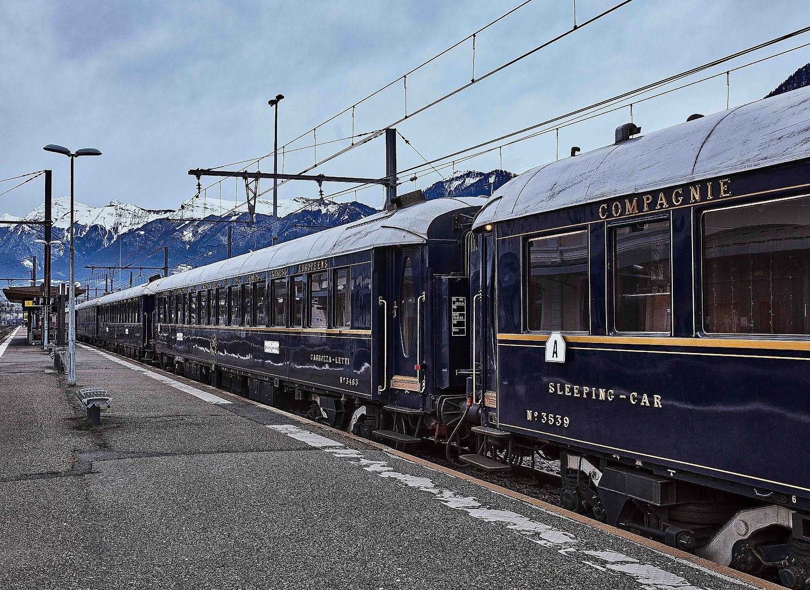 The Venice Simplon-Orient-Express train passing through the Alps