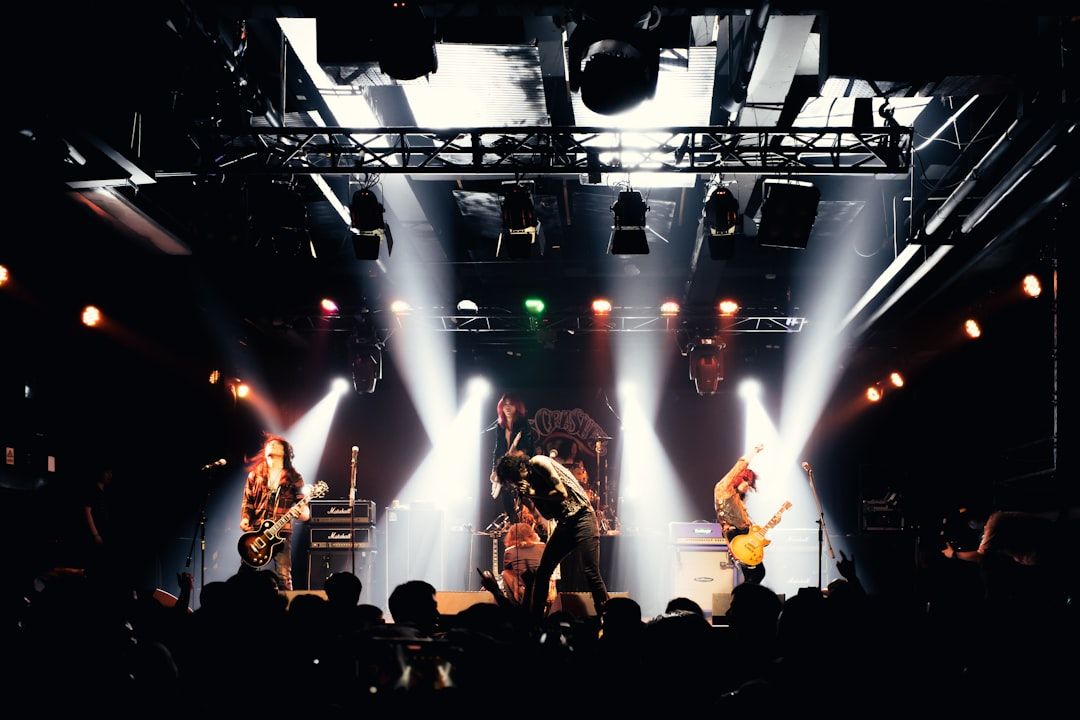 Concert arena with crowd and dramatic lighting