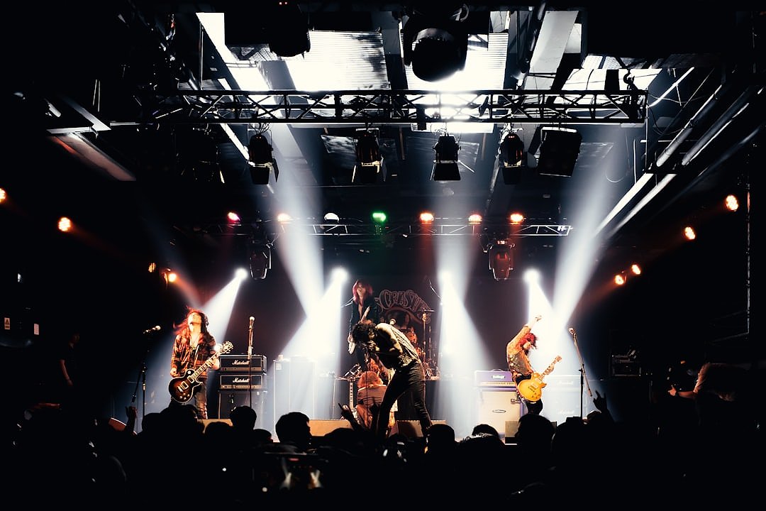 Concert arena with crowd and dramatic lighting