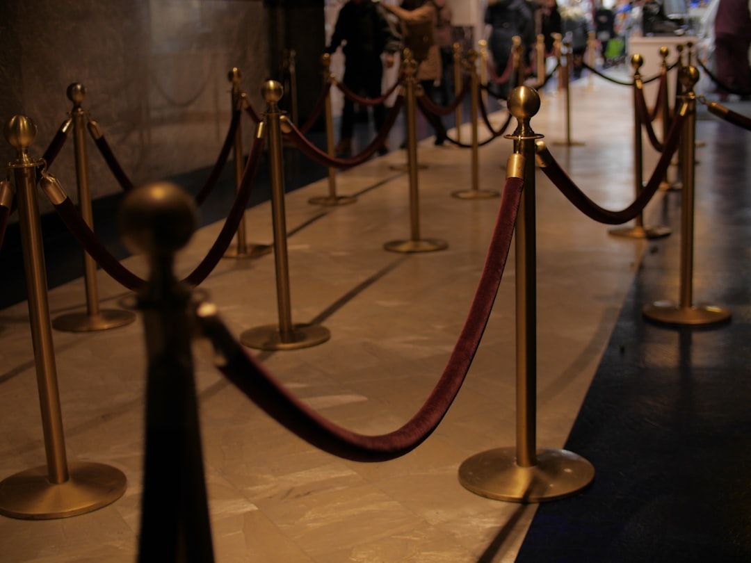 Red carpet with brass stanchions at a formal awards event