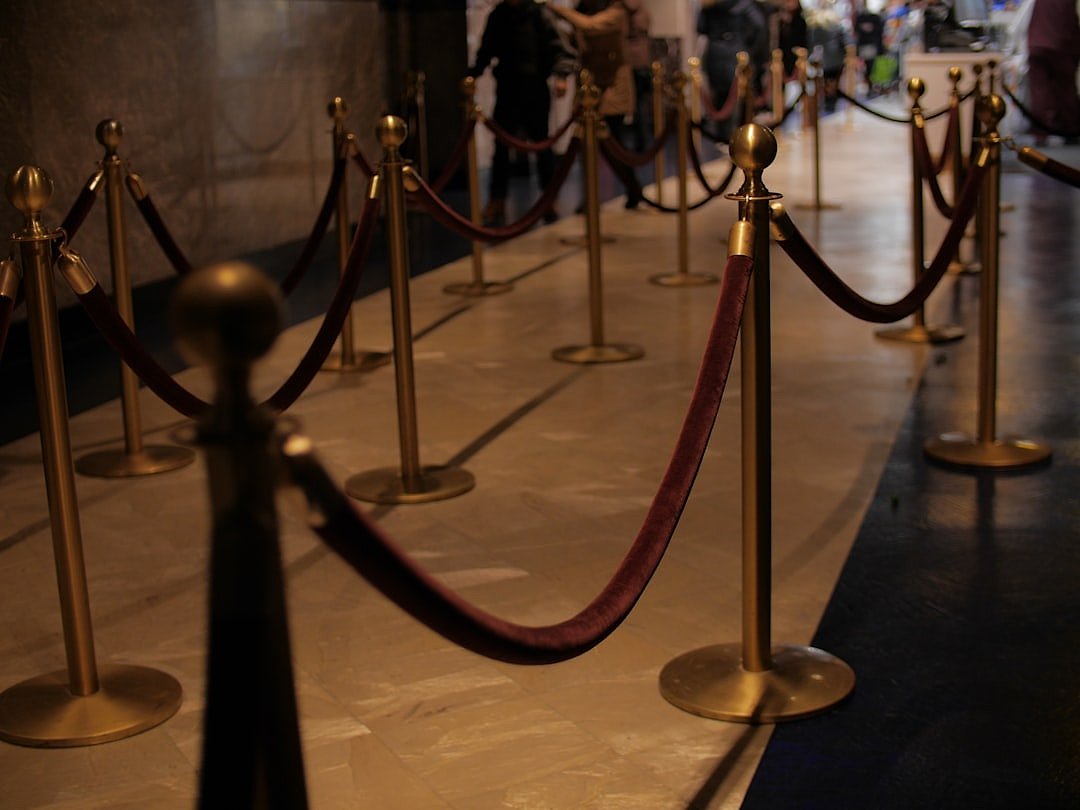 Red carpet with brass stanchions at a formal awards event