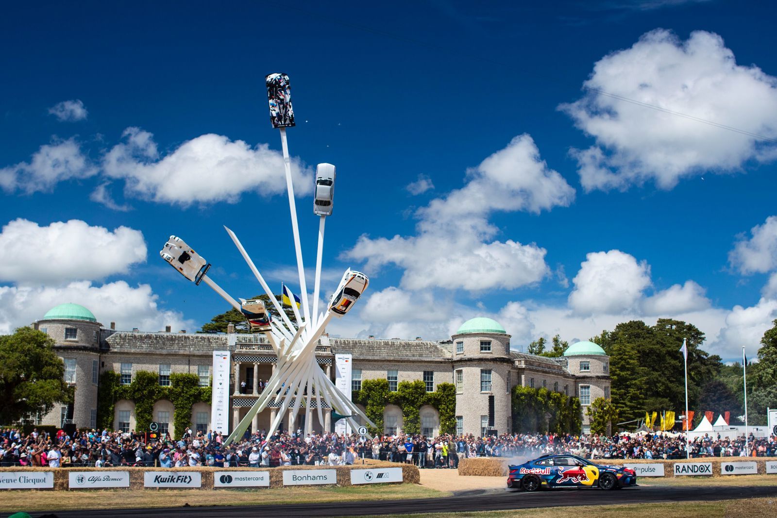 The towering Central Feature sculpture rising in front of Goodwood House at the Festival of Speed