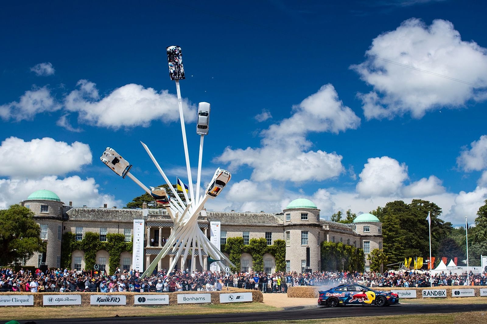 The towering Central Feature sculpture rising in front of Goodwood House at the Festival of Speed