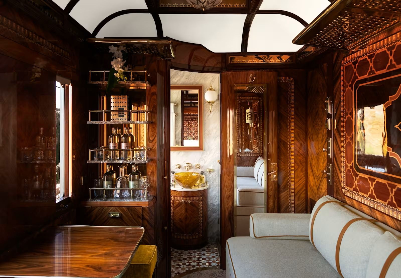 A Grand Suite aboard the Venice Simplon-Orient-Express with luxurious furnishings and Art Deco design