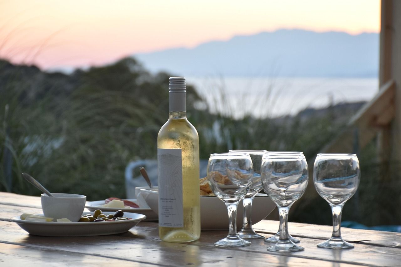 Mediterranean terrace dining with sea view at sunset