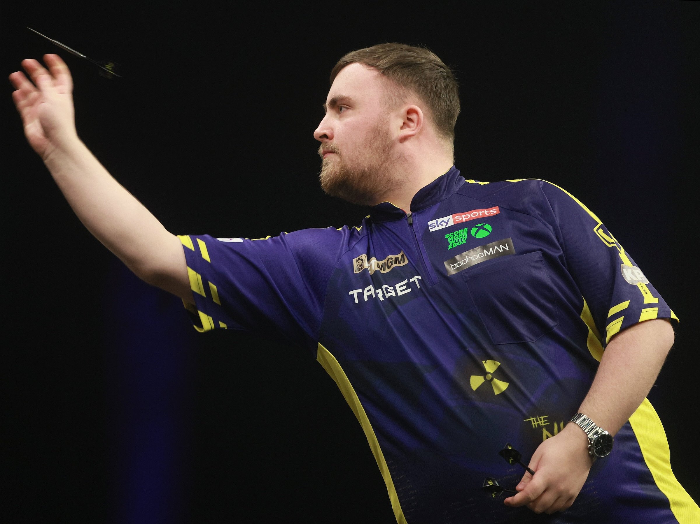 Professional darts match in progress