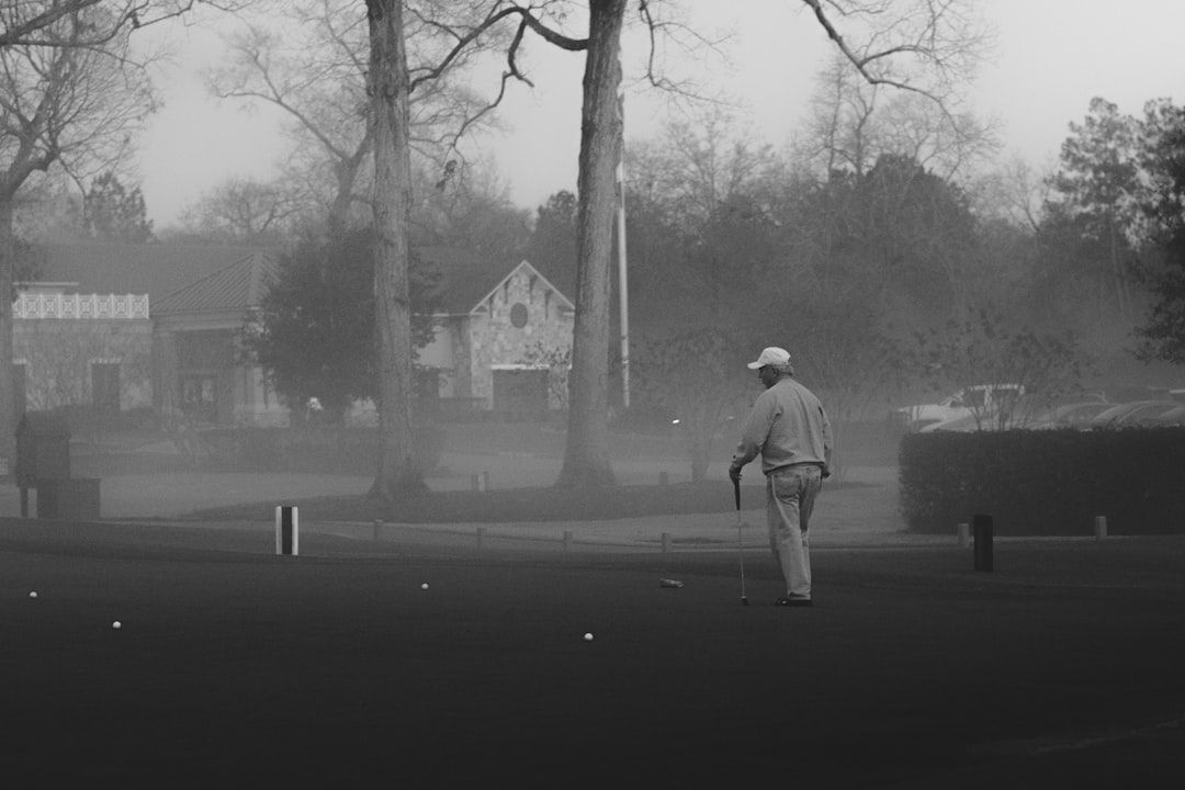 Golfer walking a course in vintage style, evoking the golden age of championship golf