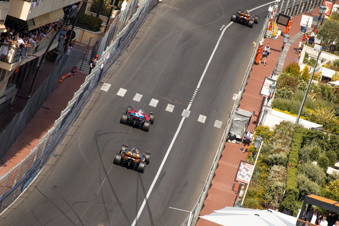 Formula 1 cars racing wheel to wheel on a tight circuit