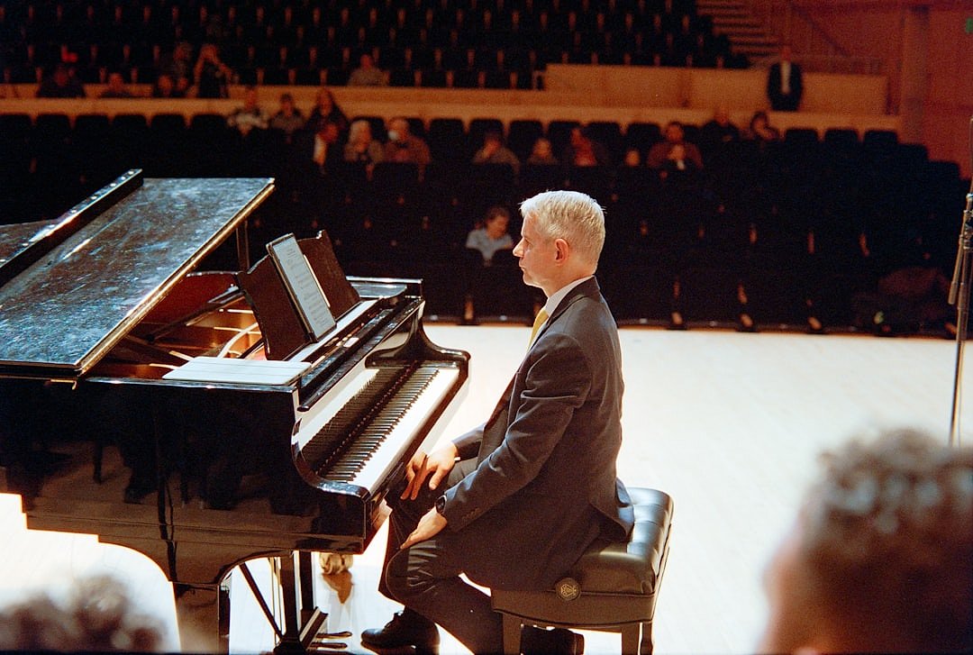 Andrea Bocelli performing at the piano in concert