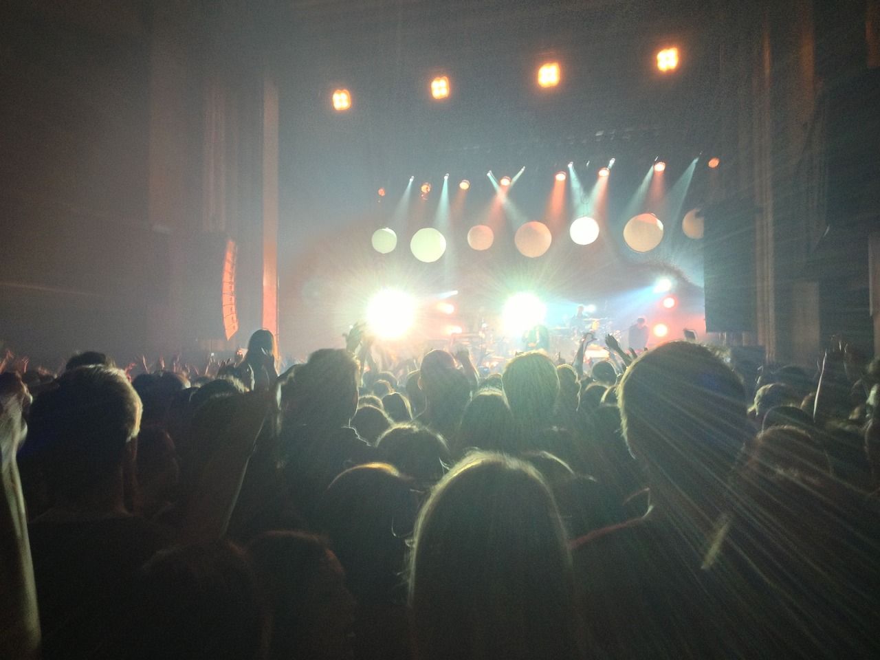 Concert crowd with bokeh stage lights in the background