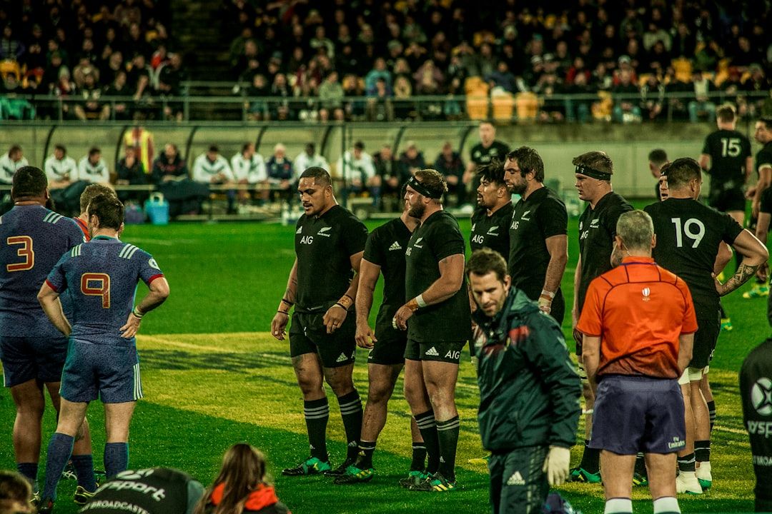 Rugby fan in a packed stadium atmosphere during an international match