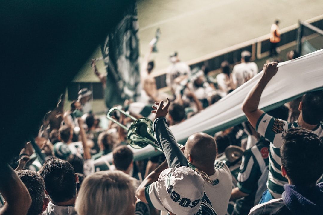 Football fans celebrating in a stadium