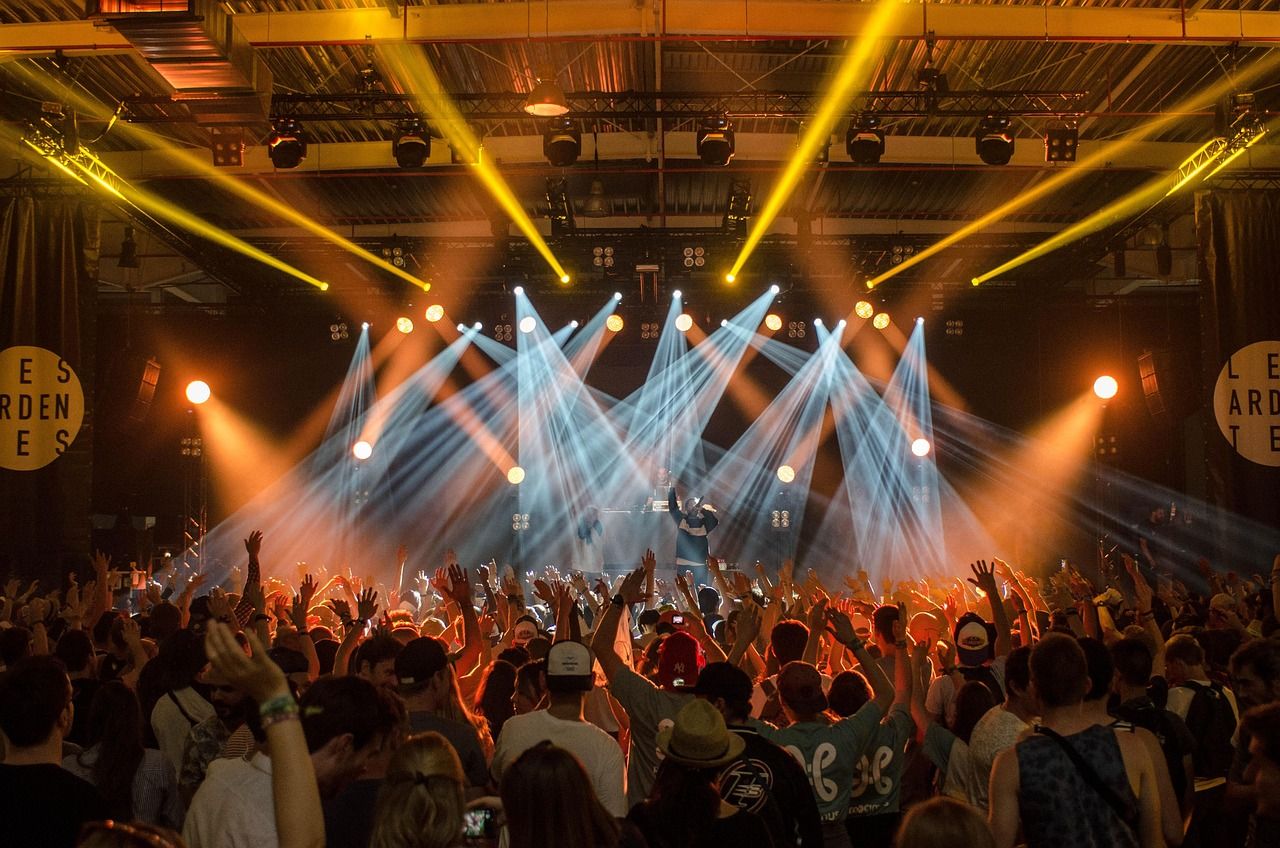 Concert stage with dramatic lighting, representing Elvis's enduring legacy in live entertainment