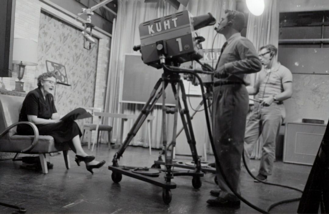 Vintage black and white photograph of a television broadcast studio with cameras and crew