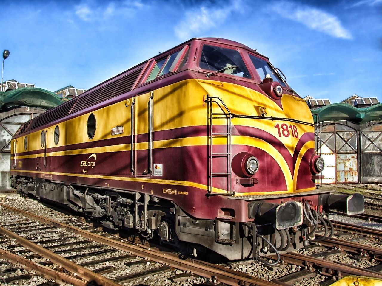 Vintage steam locomotive on railway tracks, evoking the golden age of rail travel