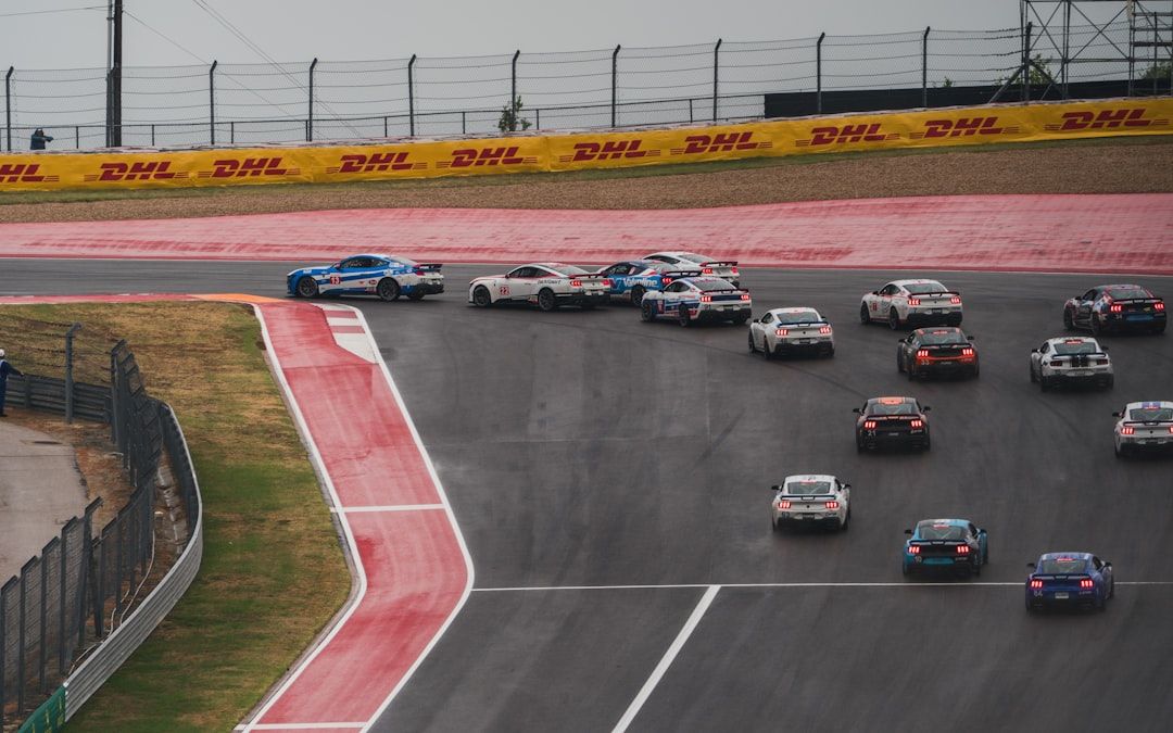 Formula 1 cars racing in wet conditions at Circuit of the Americas